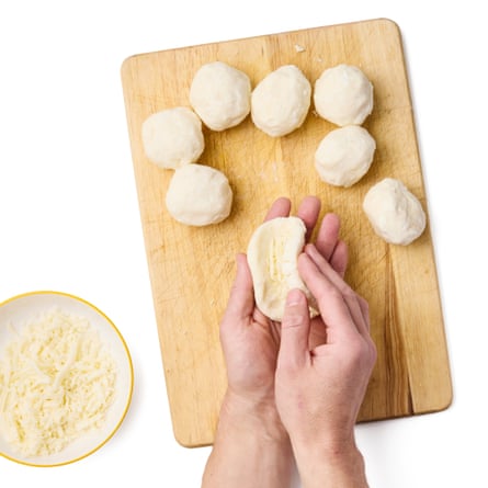 02b Felicity Cloake’s arepas ... Using damp hands, divide the dough into six even pieces, roll into balls, then, working one ball at a time and on a wooden surface for ease, flatten one to about 8cm wide and a little shy of 1cm thick.